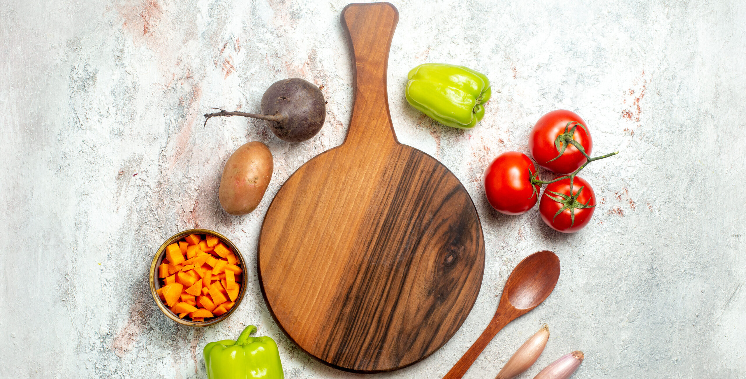 top-view-fresh-vegetables-with-sliced-pepper-white-space